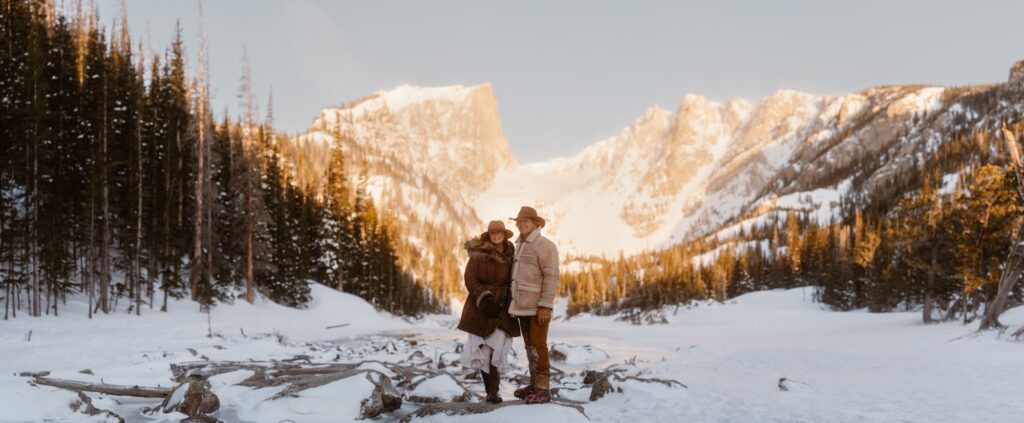 Panoramic photo of couple at Dream Lake in April