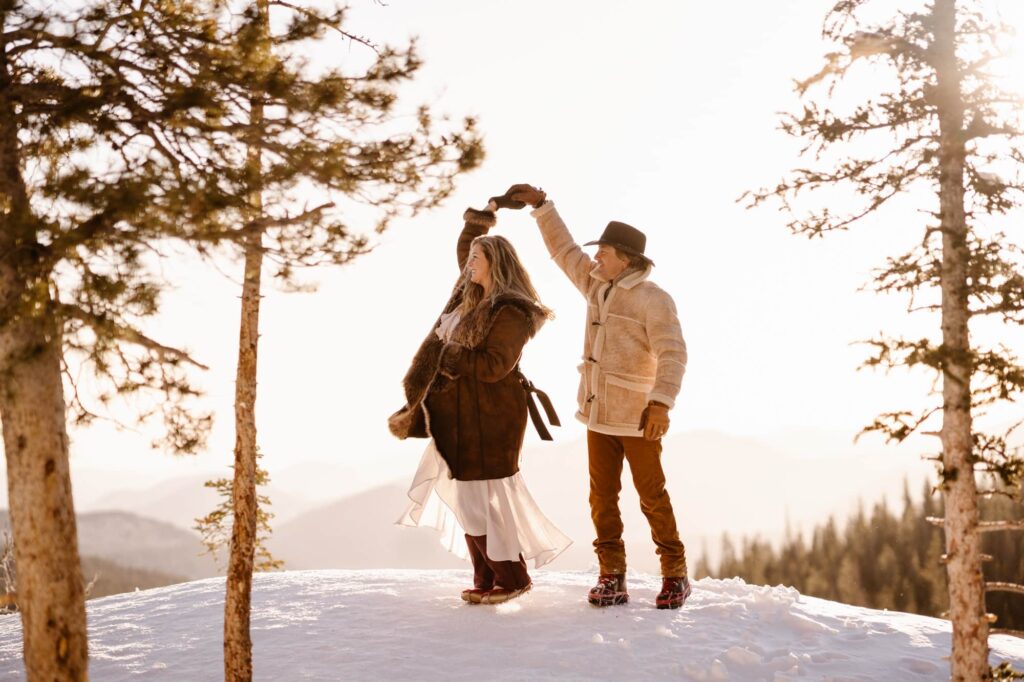Close up of couple smiling and dancing in the mountains of Estes Park