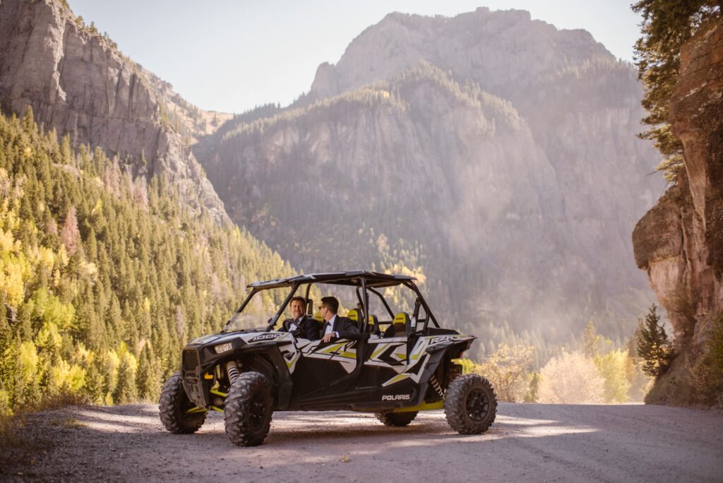 couple with a UTV on a dirt road in Colorado during their off-roading elopement