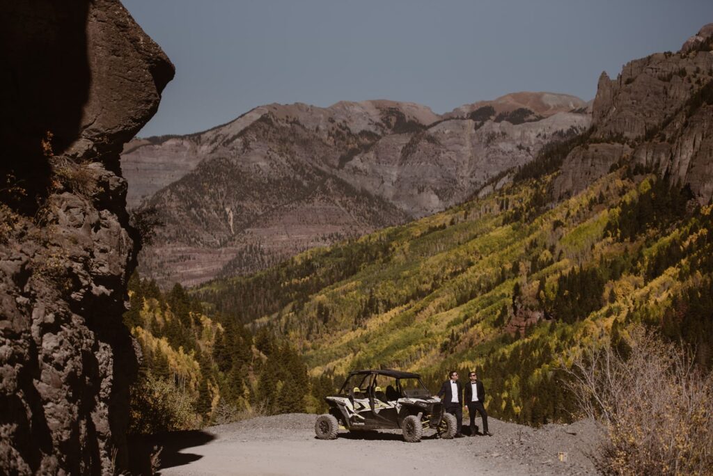 couple standing with a UTV in mountains of Ouray Colorado