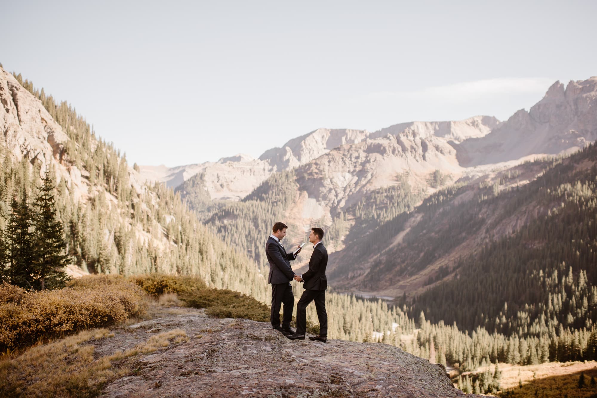 couple exchanging vows on a mountaintop