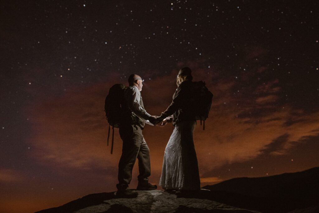 bride and groom under starry night sky during their Colorado elopement