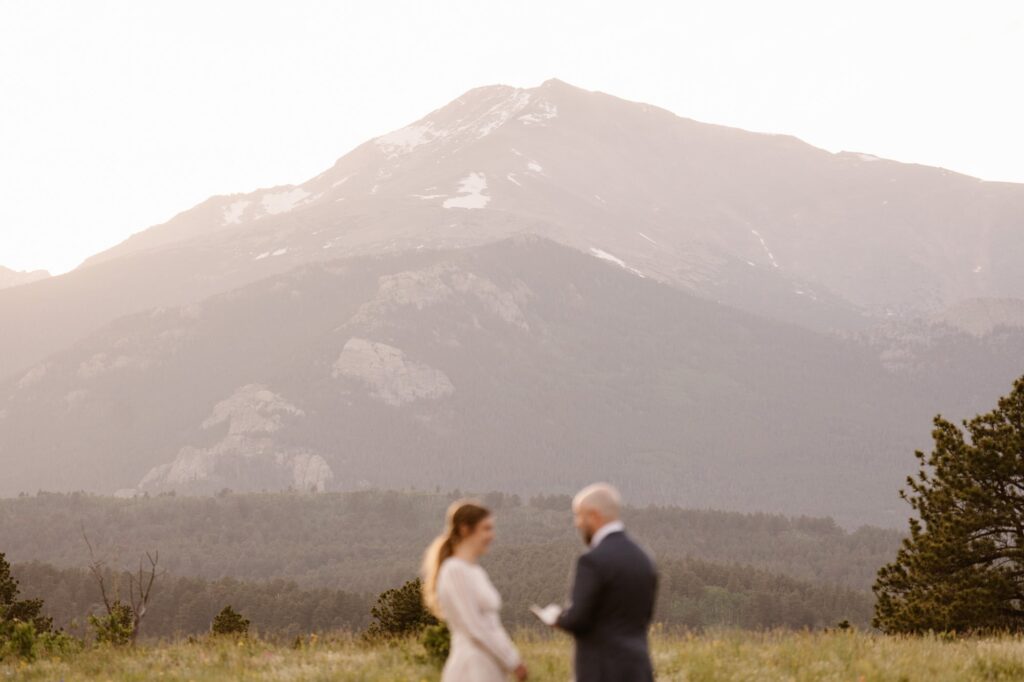 couple eloping in front of the colorado mountains
