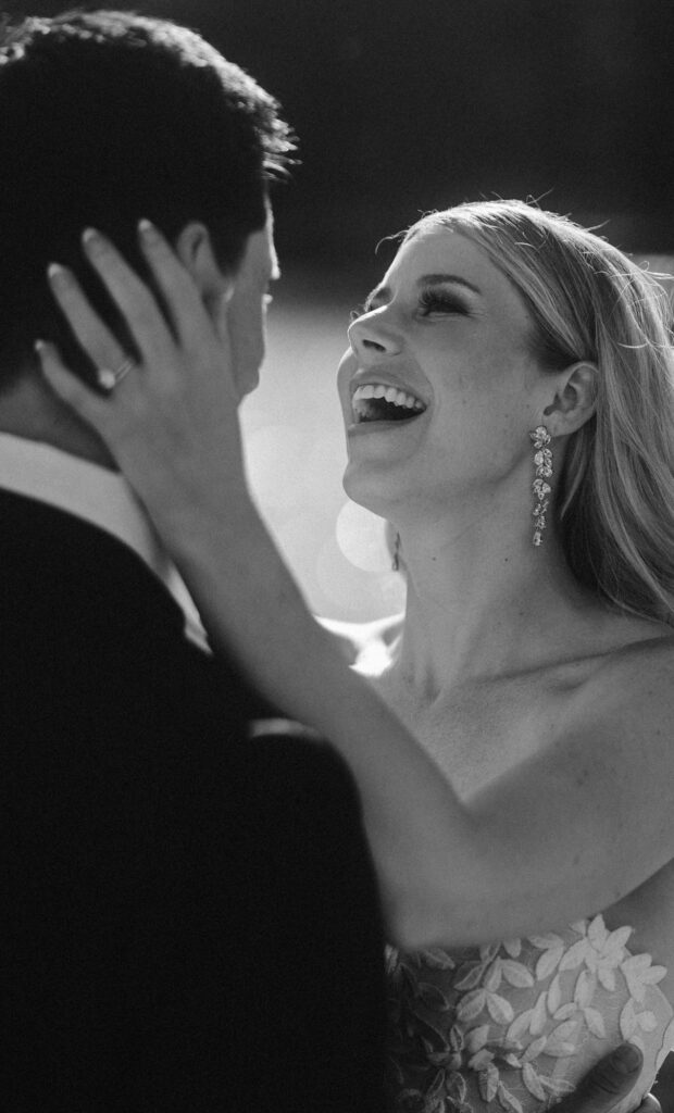 bride and groom laughing together 