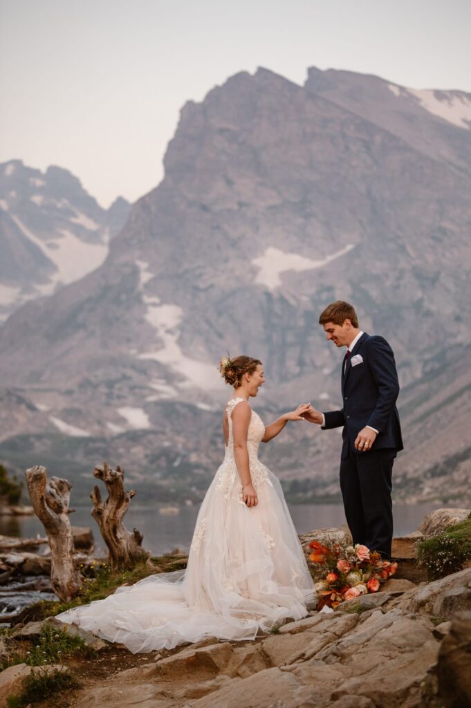 couple getting married at a mountain lake