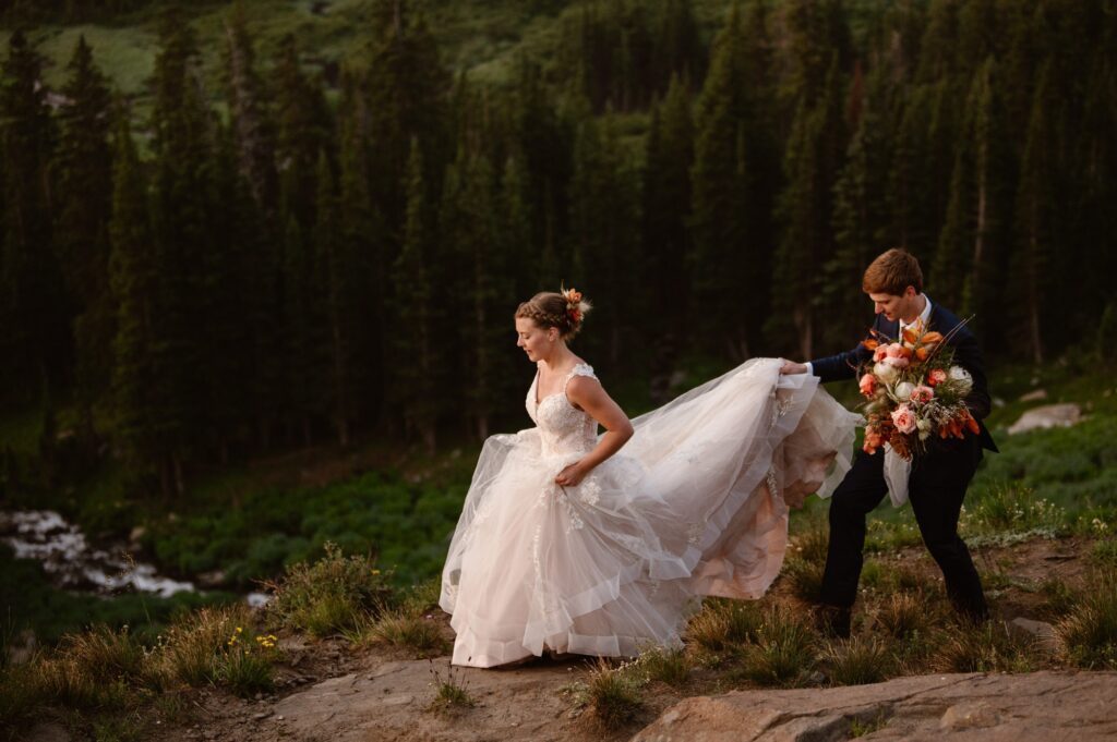 couple walking through the mountains on their elopement day