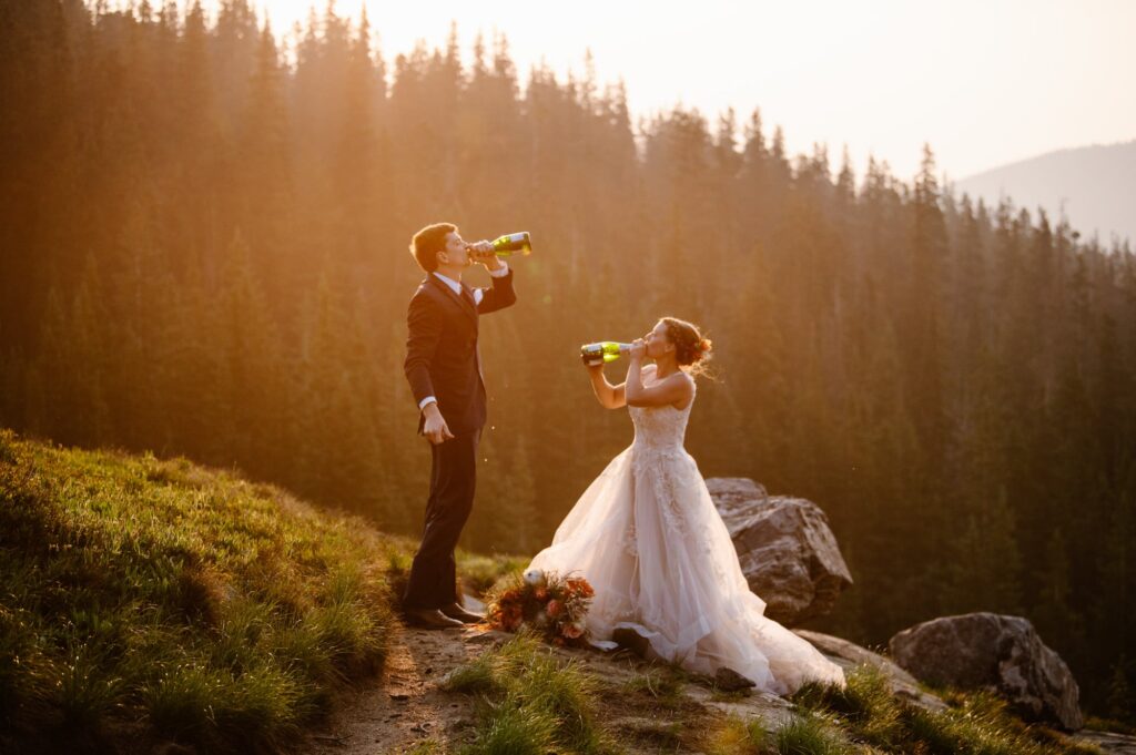 couple drinking champagne in the mountains