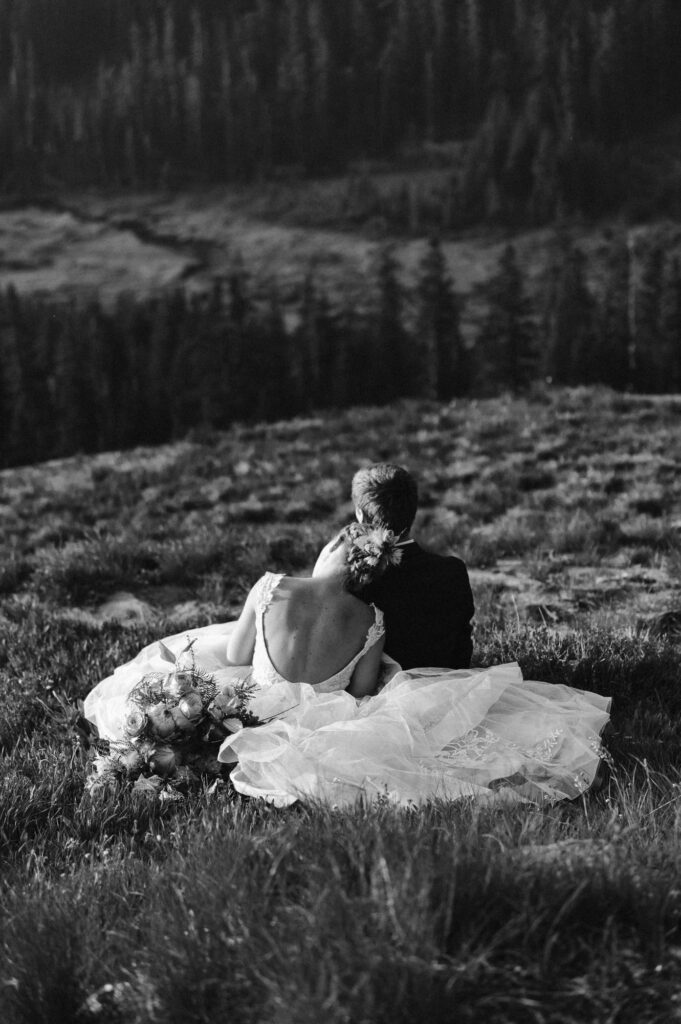 couple overlooking a mountain lake for their elopement location