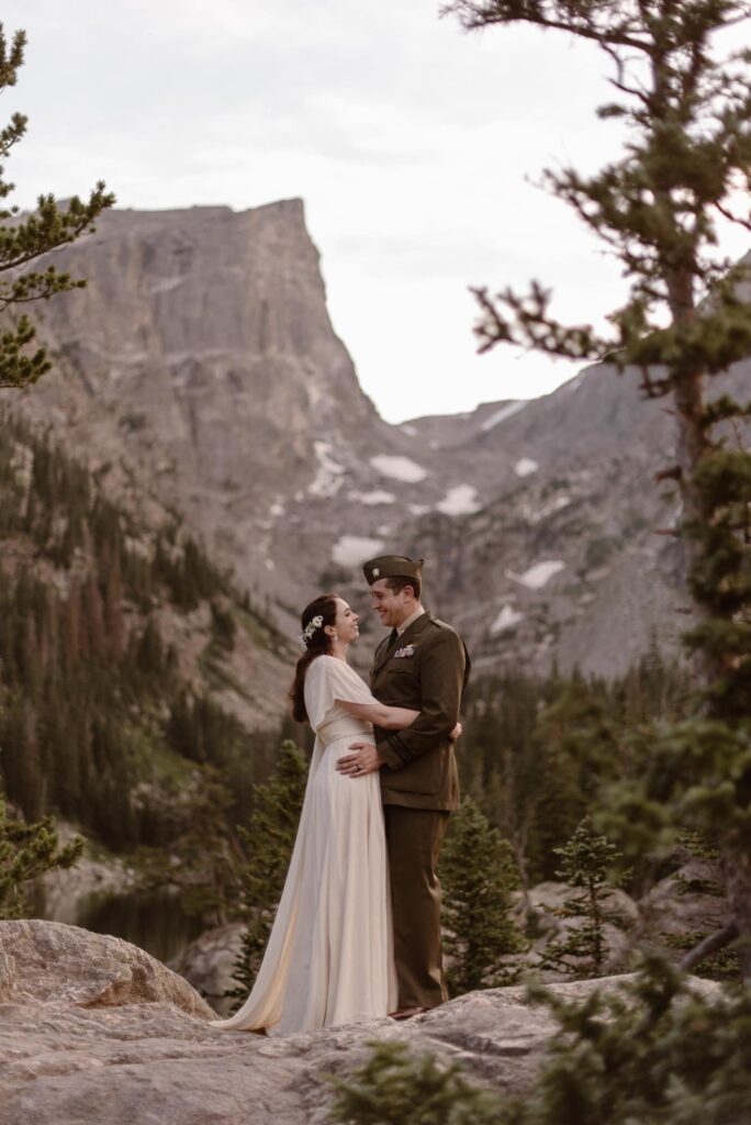 Military wedding portraits of bride and groom in the mountains of Colorado