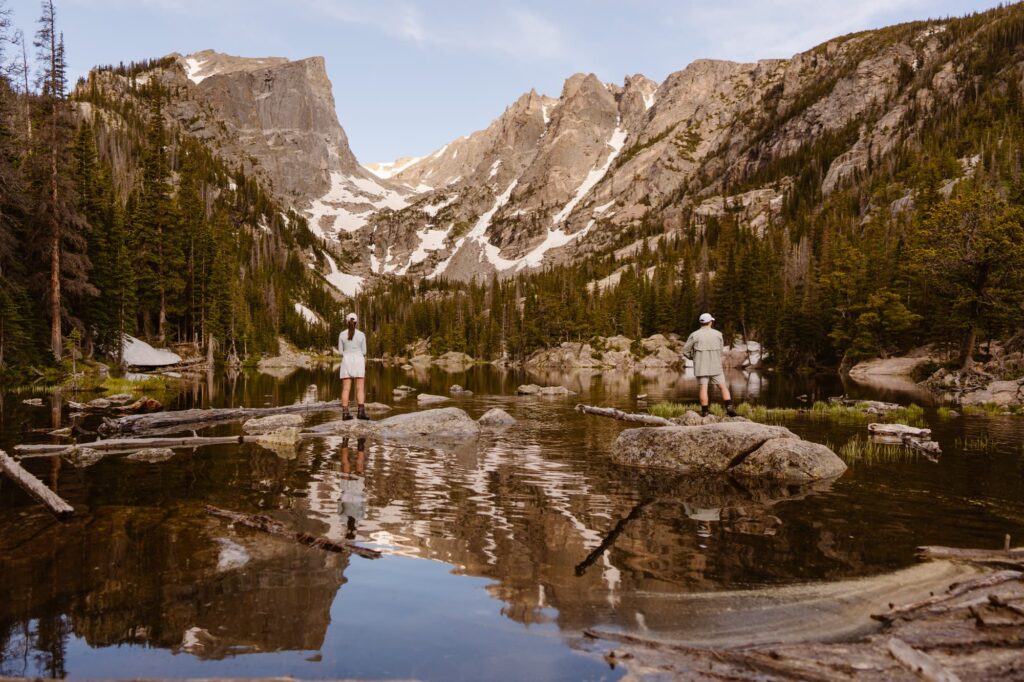 Couple fly fishing at Dream Lake in Colorado moments before their surprise proposal