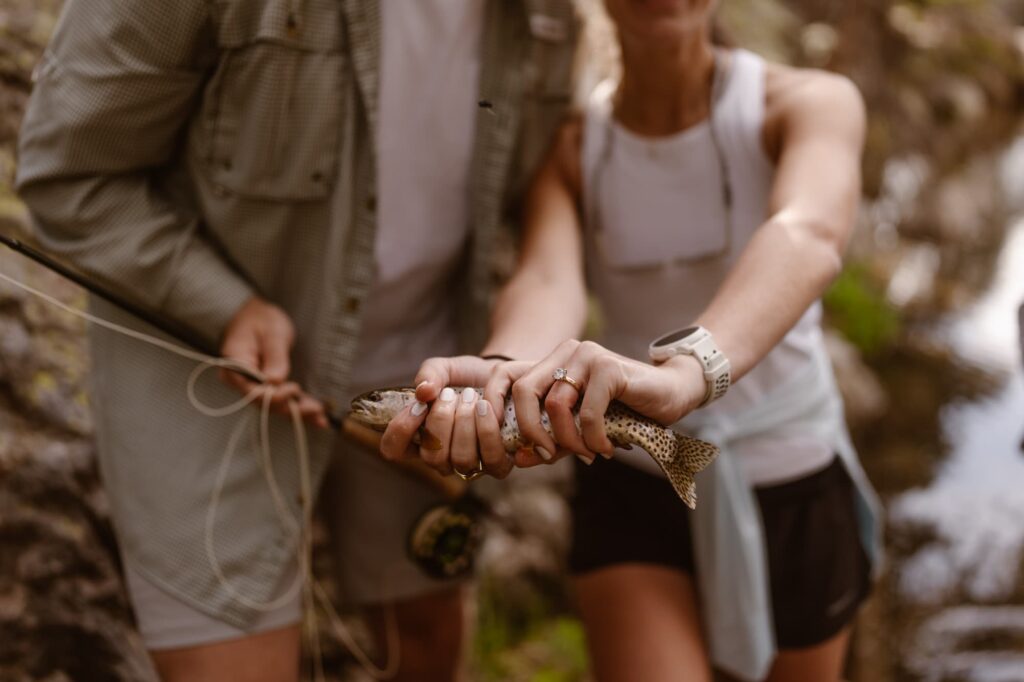 Fly fishing proposal with fish and engagement ring