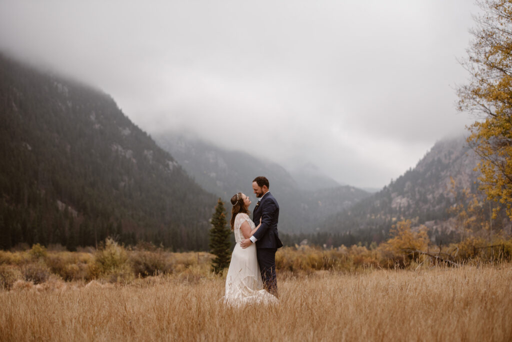 Couple looking at each other in the mountains of Colorado