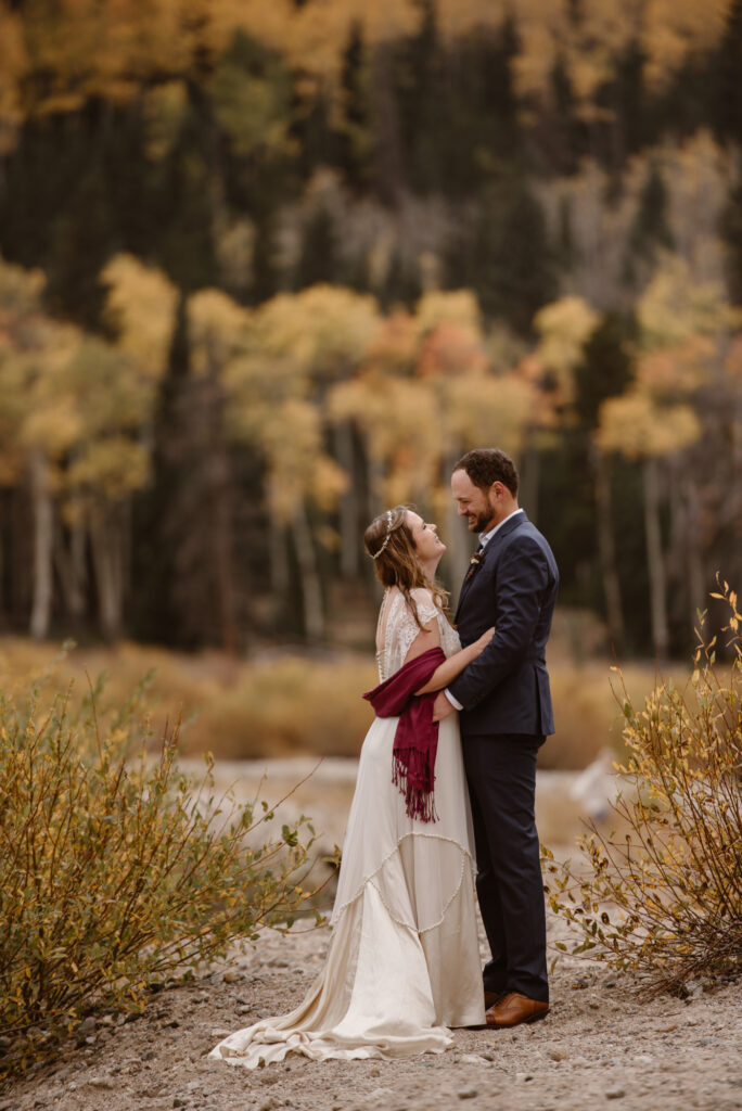 Bride and groom with Autumn foliage in October