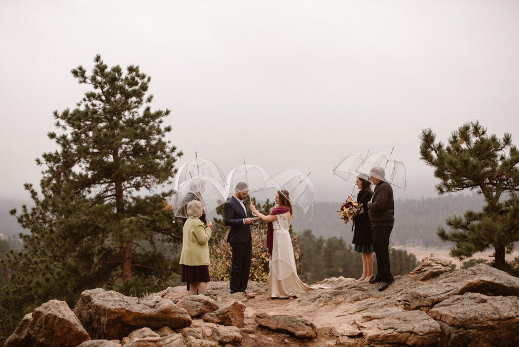 Couple getting married at 3M Curve in Rocky Mountain National Park in the fog