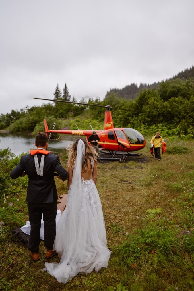 Bride and groom boarding helicopter at Bear Glacier