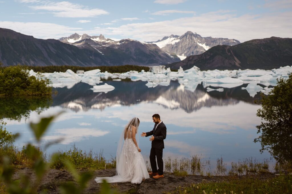 Groom seeing his bride for the first time during Alaska elopement