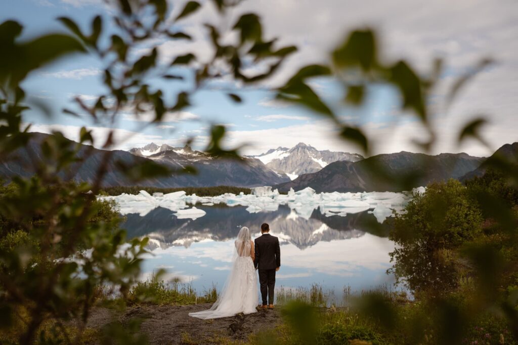 Bride and groom taking in the stunning Alaska scenery