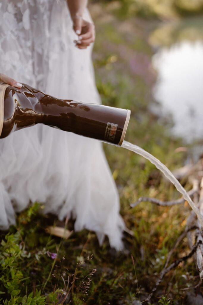 Bride spilling water out of her boots