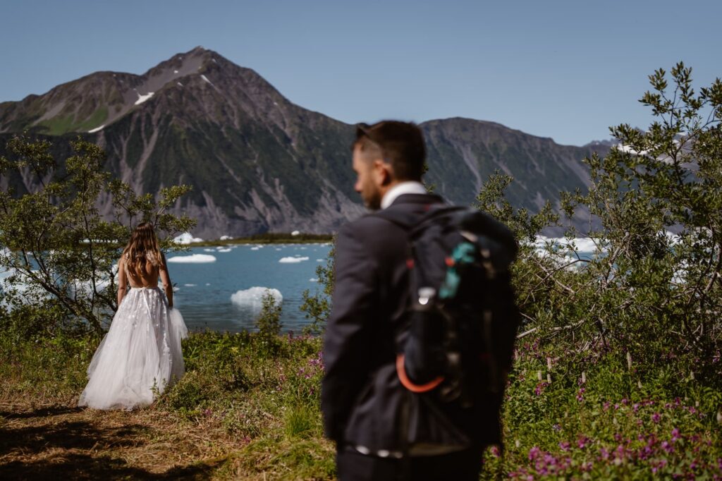 Bride and groom going hiking for an adventure elopement