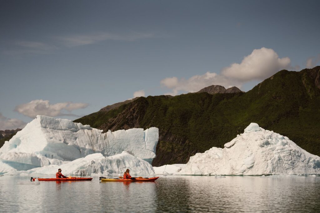 Kayaking by icebergs in Bear Glacier 