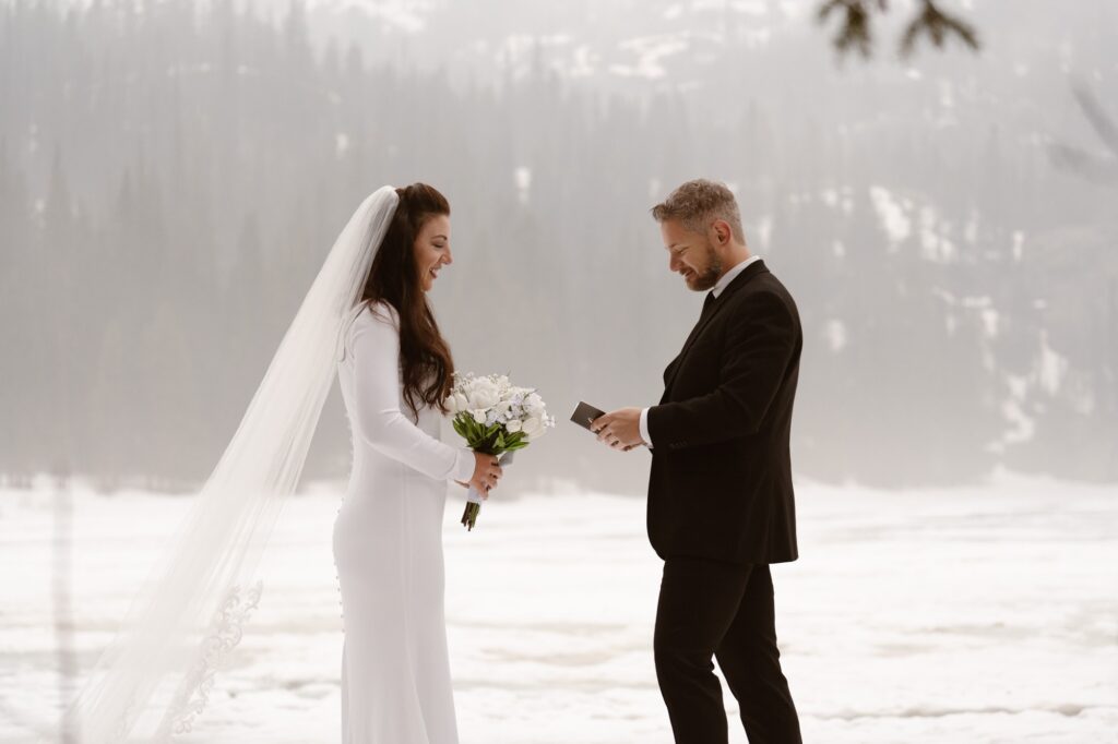 Couple at their snowy Bear Lake elopement in May
