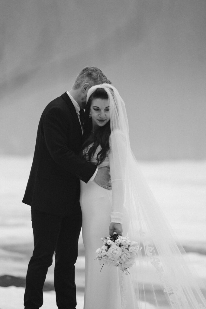 Black and white dramatic photo of wedding couple