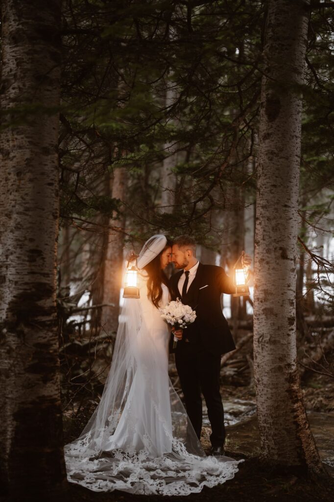 Couple almost kissing with the glow of lantern light