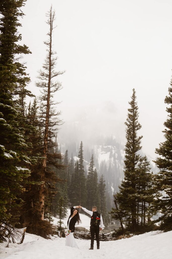 Bride and groom at Dream Lake in the winter