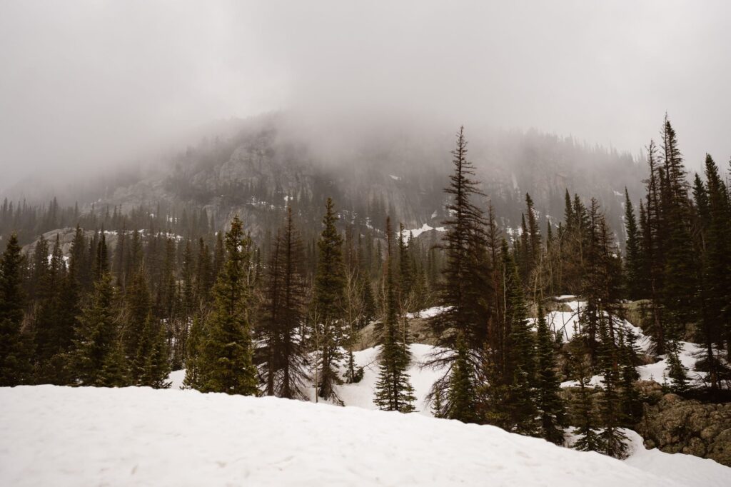 View of moody Dream Lake in the fog and snow
