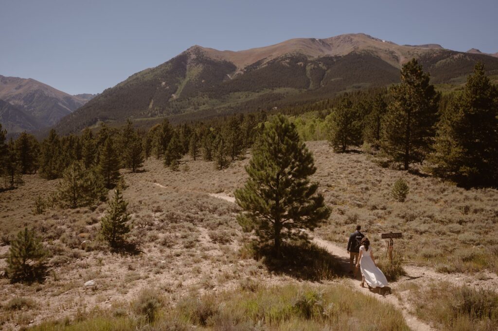 Couple hiking during their adventure elopement