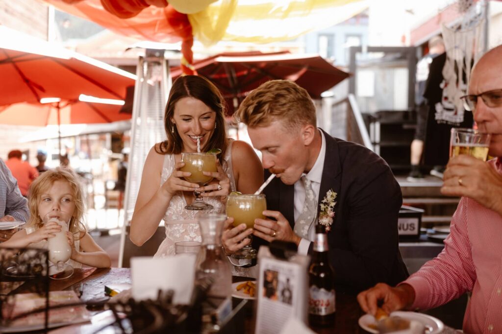 Bride and groom drinking margaritas at Secret Stash