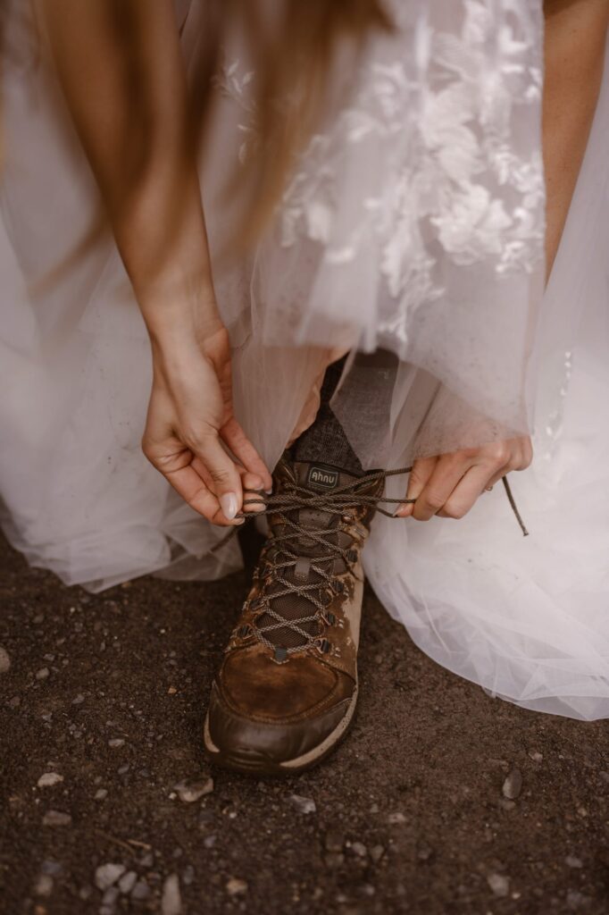 Bride lacing up her hiking boots