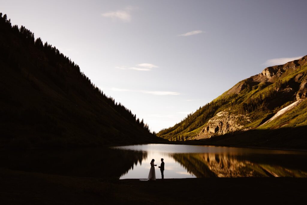 Silhouette of couple at alpine lake in Crested Butte, Co