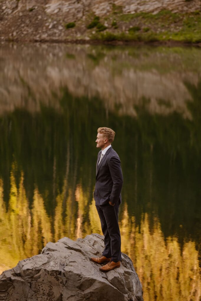 Groom portrait on the shore of a lake