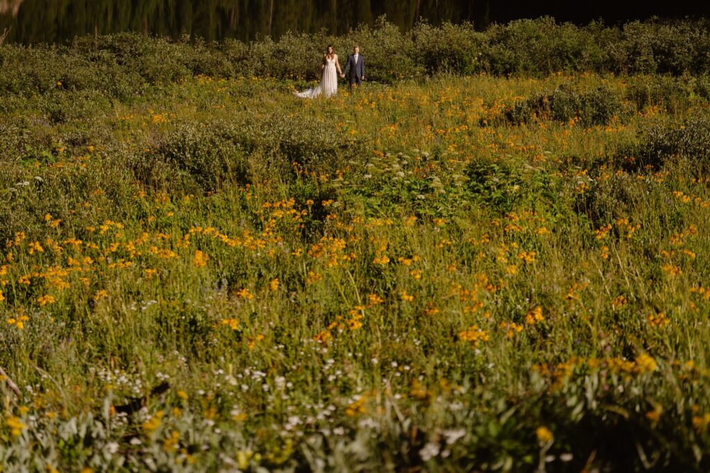 Couple in a field of wildflowers in Crested Butte