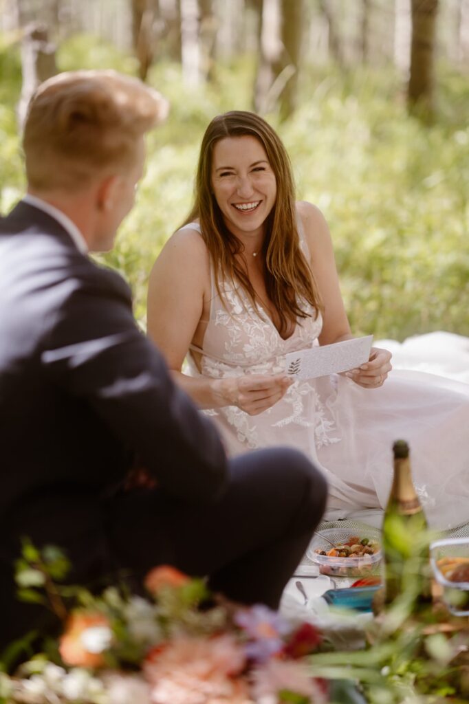 Bride laughing at picnic