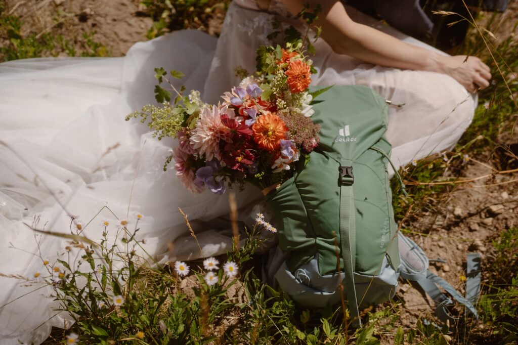 Backpack and wedding bouquet