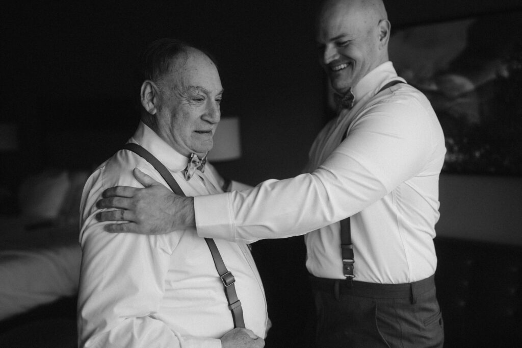 Groom and father of the bride sharing a moment