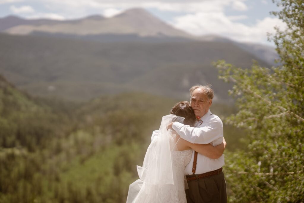 Bride shares first look with her father in the mountains of Colorado