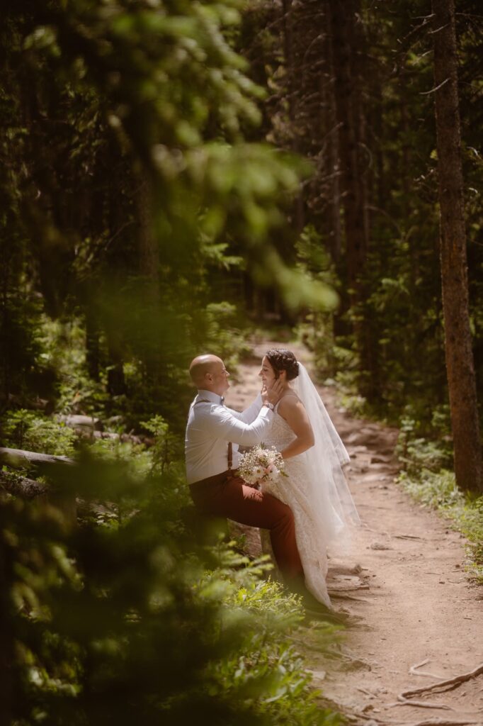 Couple on a hiking trail on their wedding day