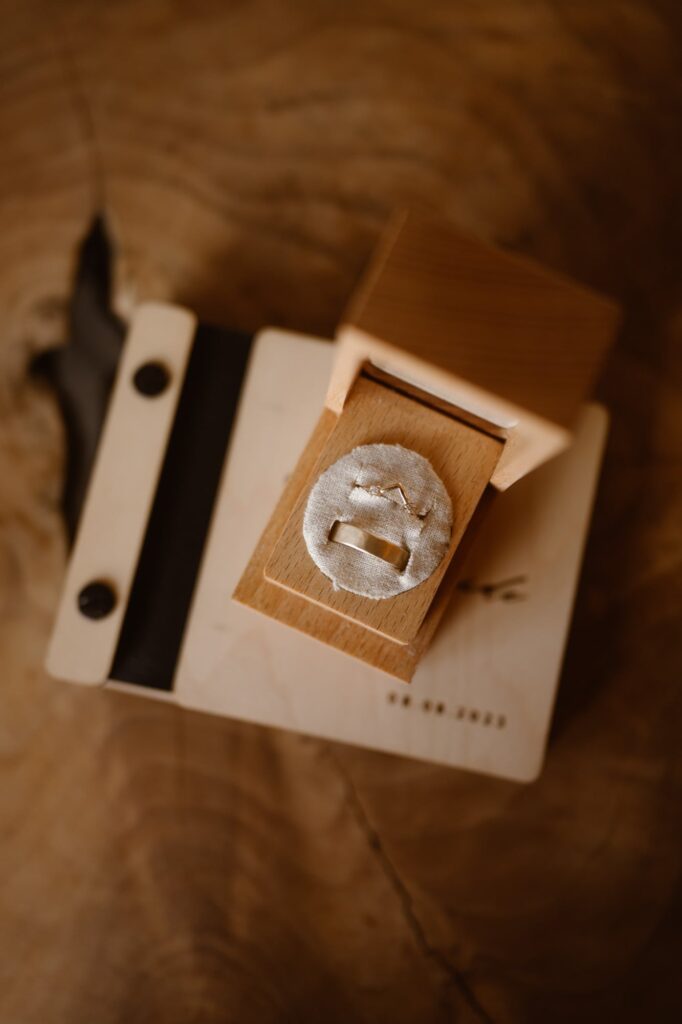 wedding rings in a box on a wooden table