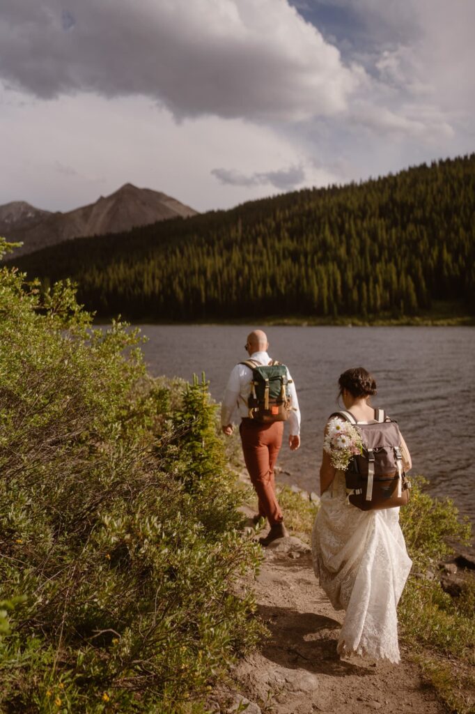 Couple hiking off along the lakeside trail
