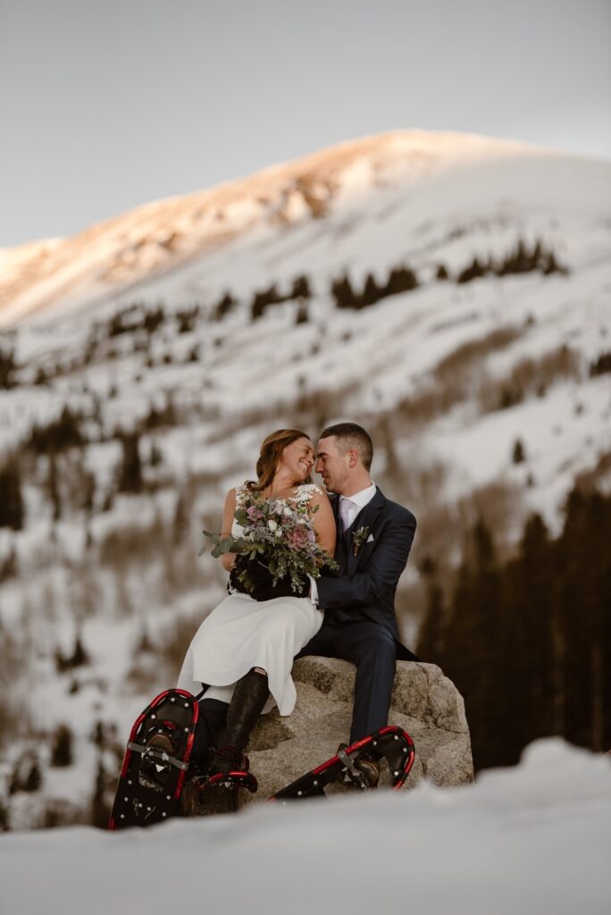 Couple in the snow mountains of Breckenridge, Colorado on their elopement day