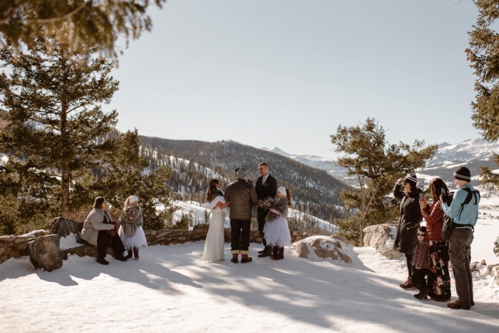 Snowy winter wedding at Sapphire Point Overlook near Breckenridge, Colorado