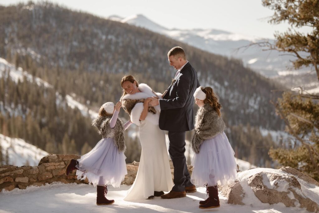 Couple standing with their kids getting married at Sapphire Point Overlook