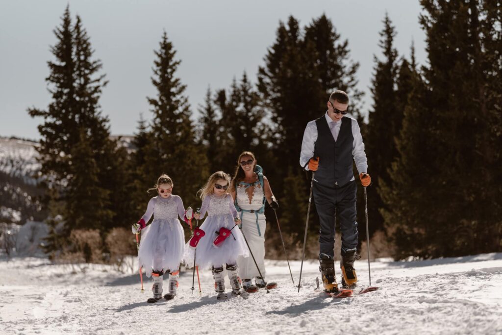 Family skiing together on their elopement day in Breckenridge, Colorado