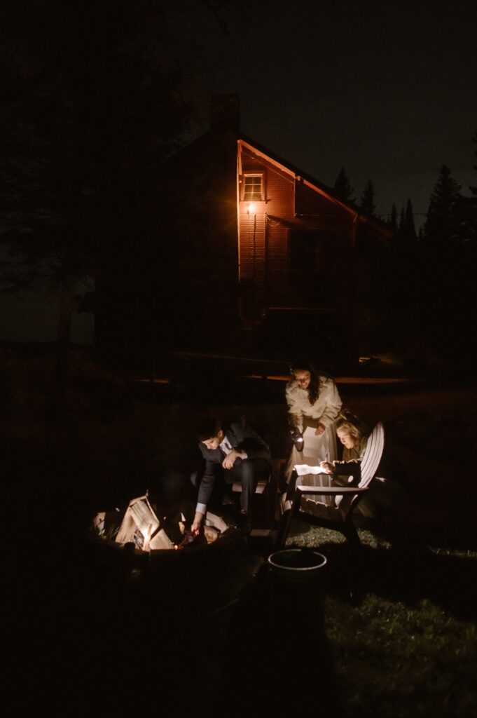 Bride and groom starting a campfire on Isle Royale National Park