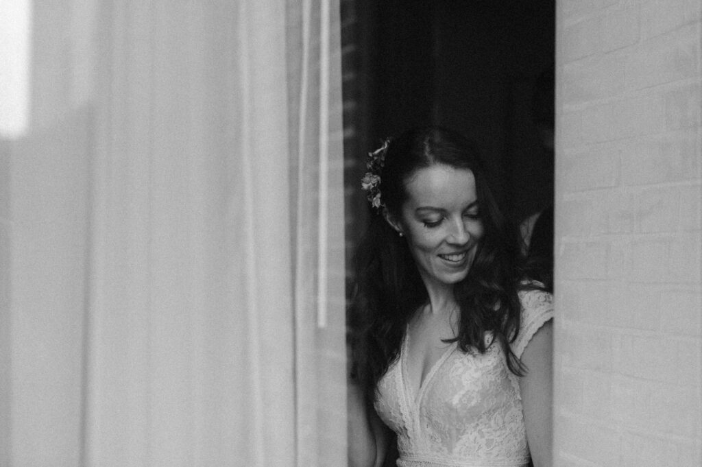 Bride getting ready for her elopement day at a boutique hotel in Michigan