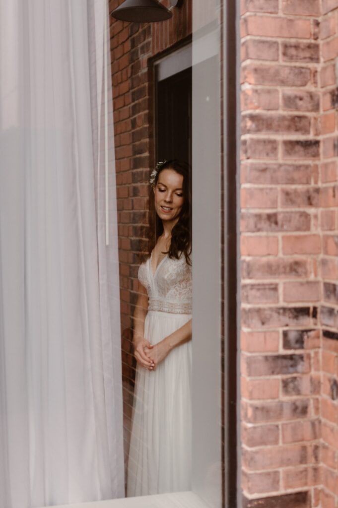 Bride looking out the window