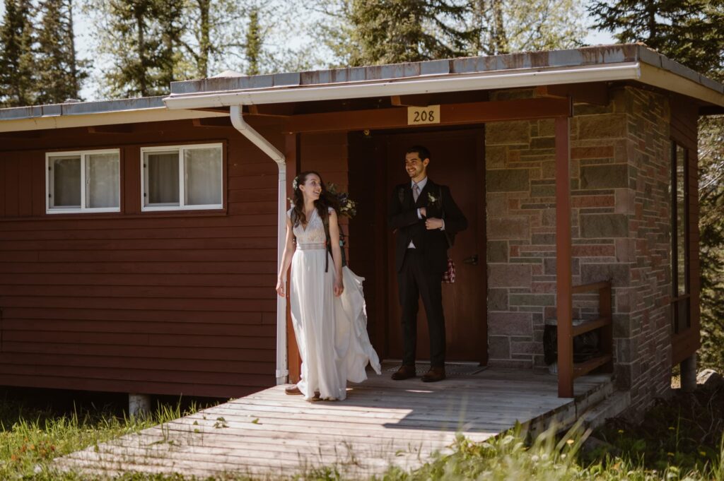 Couple at cute cabin at Isle Royale National Park on their wedding day